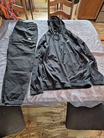 Tracksuit jacket and pants laid out