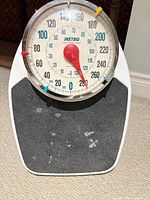 Front view showing dial, brand marking, platform surface wear