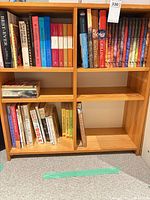 Full view of bookcase showing quantity and variety of books including cookbooks and Harry Potter set