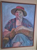 Full view of framed portrait painting on wall