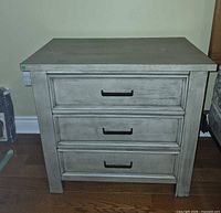 front view of nightstand showing three drawers