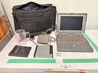 Complete lot showing laptop, peripherals, mug and bag