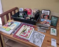Overall lot view on desk showing pen, frames, office supplies