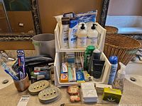 Full lot on countertop showing baskets, waste bin, toiletries