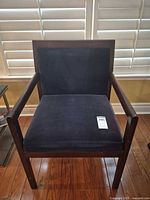 Front view of upholstered wood side chair