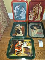 Group shot of all five Coca-Cola trays