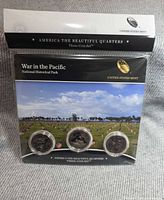 Front of sealed US Mint three-coin set