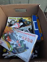 Box interior showing Tristar kit, Rush Emperor kit and built cars