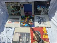 Front view of all eight record jackets
