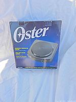 Front of Oster hot plate retail box