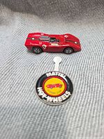 Ferrari 312P redline car and matching collector button, top view