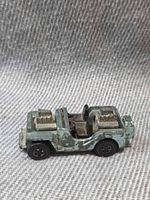 Left side view of die-cast Grass Hopper Jeep showing dual engines and paint wear