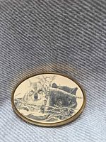 Front view showing wolf scrimshaw artwork