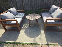 Full view of both loveseats with cushions and coffee table