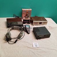 View of all electronics including Sony Watchman, Lucky Boy radio, Astrocom Pilot headphones in box, Realistic scanner