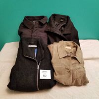 Four women's jackets laid flat on a white surface, showing different textures and colors including black and olive green suede.