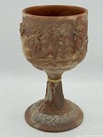 Full view of chalice front with relief figures