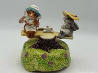 Full view of ceramic rabbit seesaw music box