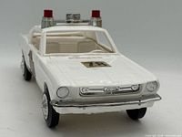 Front three-quarter view showing hood number 78, grille, and roof lights