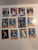 All 12 baseball cards laid out in three rows of four