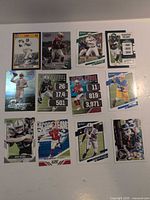 All 12 football cards laid out for full lot overview
