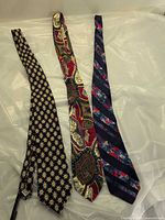 Three silk neckties laid flat showing full patterns