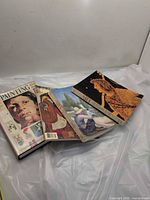Four art textbooks laid out showing covers