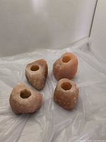 Four Himalayan salt candle holders group view