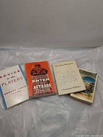 Four paperback books laid out: Advice to the Players, Enter the Actress, The Glass Menagerie, Structures
