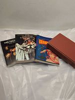 Four theatre books laid out showing covers