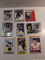 Nine hockey cards laid out in three-by-three grid