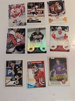 All nine hockey cards laid out in three-by-three grid