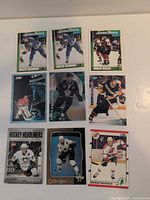 Nine hockey cards laid out in 3×3 grid