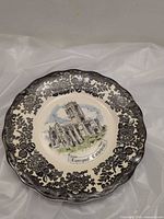 Front view of plate showing Liverpool Cathedral scene and border detail