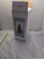 Original box showing product image and label