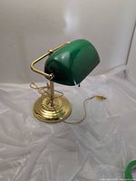 Full view of banker lamp showing green shade and brass base