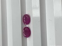 Front view of two matching oval rubies