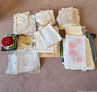 pile of assorted linens on floor showing quantity and variety