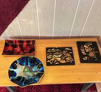 Group shot showing all four plaques on table