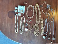 Full layout of assorted necklaces, bracelets, earrings and pendants