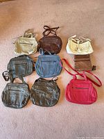 All nine bags laid out showing colors and style