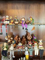Full view of mixed figurines on two shelves