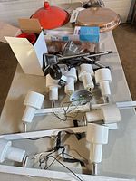 assortment of track fixtures, loose heads, wiring, solar light, pendant shade