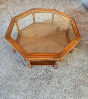 Top view showing octagonal glass surface and wood frame