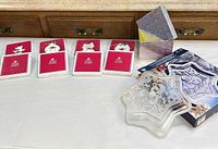 Group shot showing four red Royal Albert ornament boxes and glass star dish with its box
