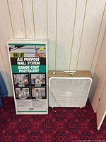 Boxed Trac-Loc wall system next to beige box fan