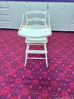 Front view of high chair with tray attached