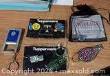 Group of promotional keychains, pin set, bracelet pouch