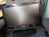 Front view of Toshiba 22-inch monitor powered off on chair