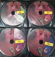 Four discs (Disks 5-8) in sleeve with labels visible